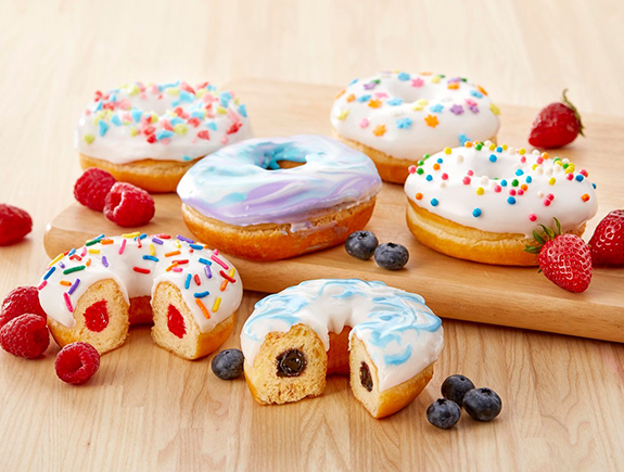 Baker Boy Magic Ring donuts displayed with fresh blueberries, raspberries, and strawberries